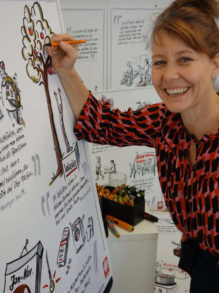 Britta Krondorf beim Zeichnen für die Caritas zum Thema Armut